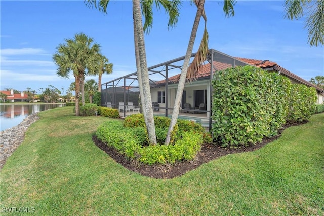 view of yard featuring a water view and a lanai