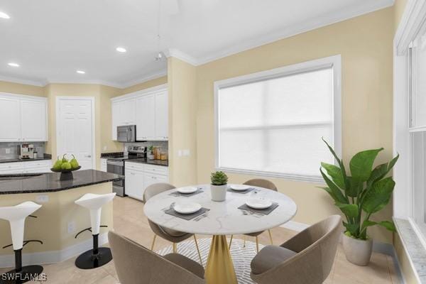 12560 Wildcat Cove Cir, Estero, FL 33928 - kitchen with stainless steel electric stove, tasteful backsplash, white cabinetry, crown molding, and a kitchen bar