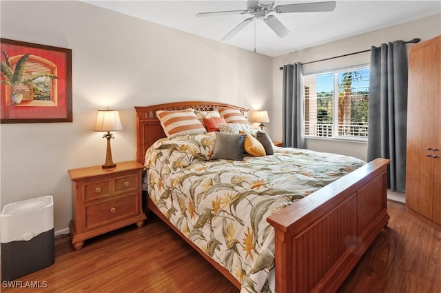 bedroom featuring ceiling fan and dark hardwood / wood-style flooring