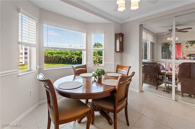 dining area with light tile patterned floors, crown molding, and ceiling fan