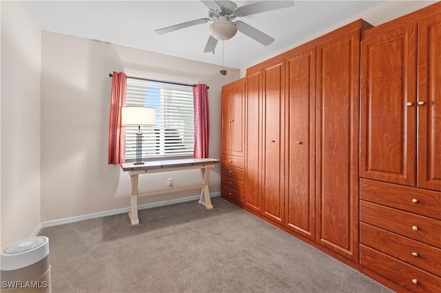 unfurnished bedroom featuring light carpet and ceiling fan