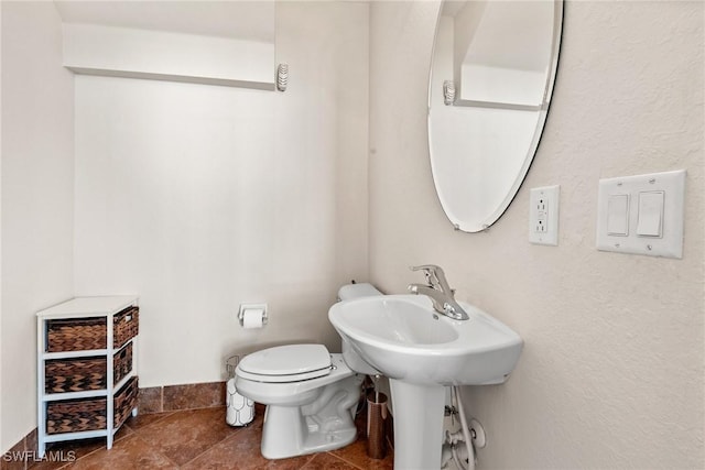 bathroom featuring toilet