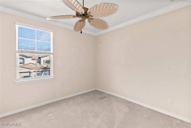 unfurnished room featuring light carpet, ornamental molding, and ceiling fan