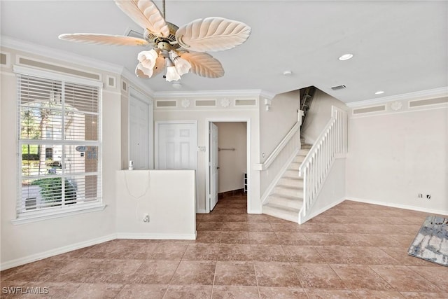 unfurnished room with crown molding and ceiling fan