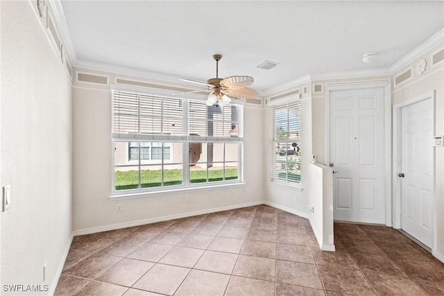 interior space with ceiling fan, ornamental molding, and tile patterned flooring