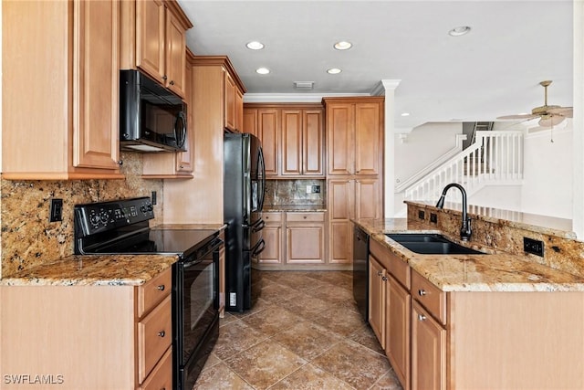 kitchen featuring sink, ceiling fan, black appliances, light stone countertops, and decorative backsplash