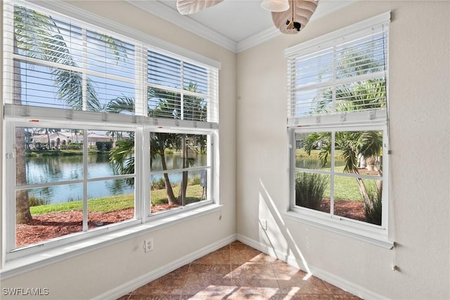 spare room featuring ornamental molding and a water view