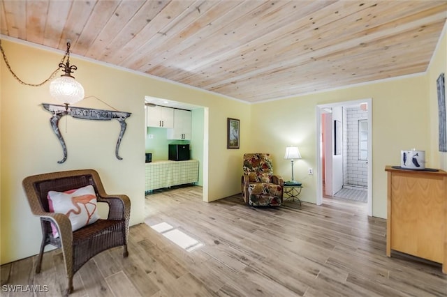 living area featuring crown molding, wood ceiling, and light hardwood / wood-style floors