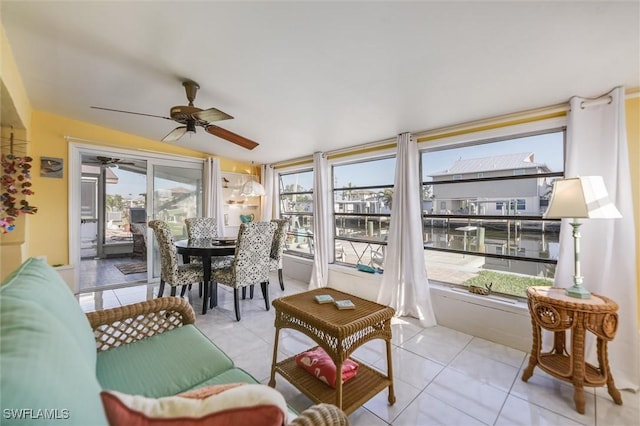 sunroom featuring ceiling fan