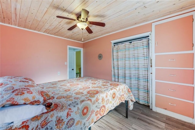 bedroom featuring crown molding, ceiling fan, wood ceiling, and hardwood / wood-style floors