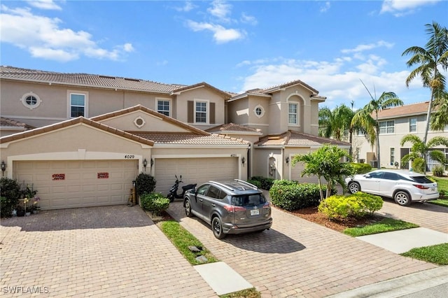 mediterranean / spanish house featuring a garage