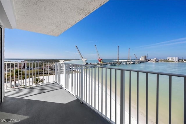 balcony featuring a water view