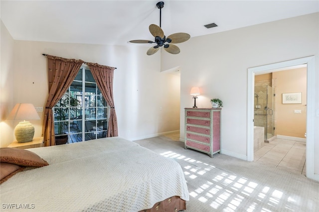 bedroom featuring ceiling fan, ensuite bath, and light carpet