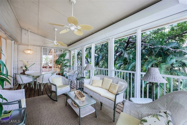 sunroom / solarium with vaulted ceiling and ceiling fan