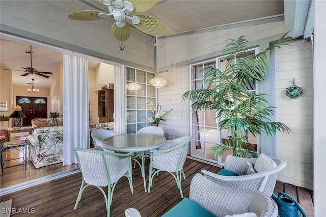 sunroom / solarium with ceiling fan