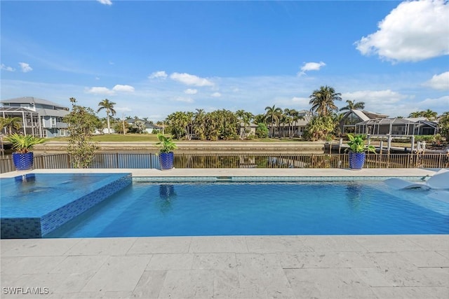 view of swimming pool with a water view