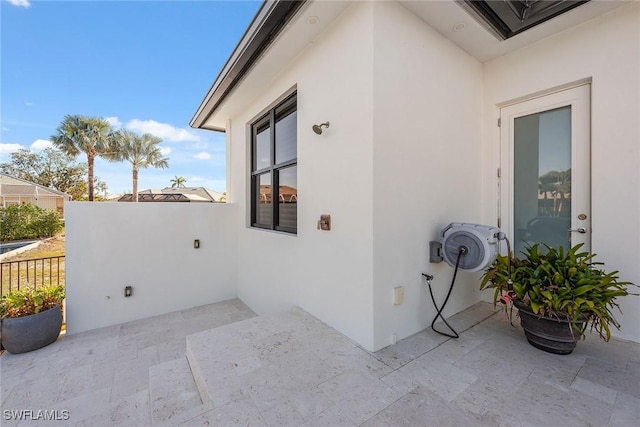 view of property exterior with a patio