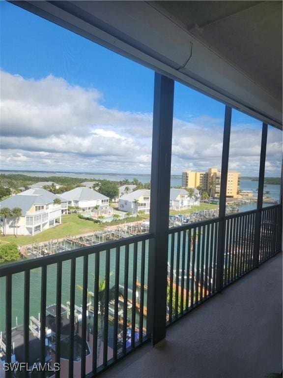 balcony featuring a water view