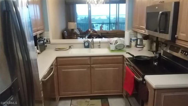 kitchen featuring stainless steel appliances and kitchen peninsula