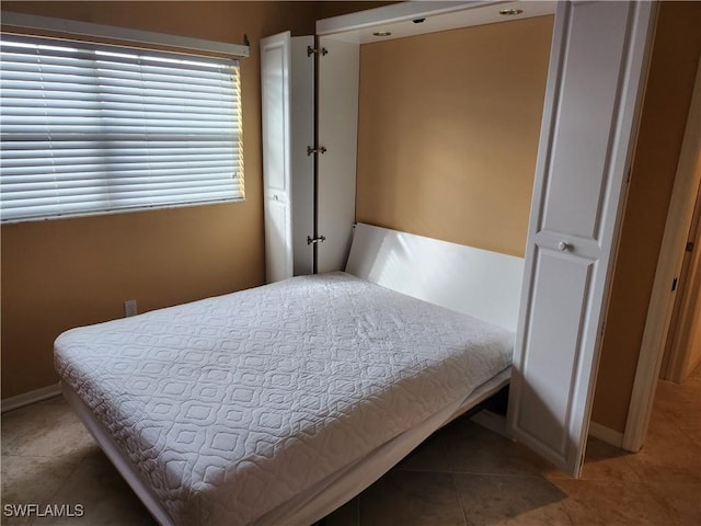 bedroom featuring tile patterned flooring