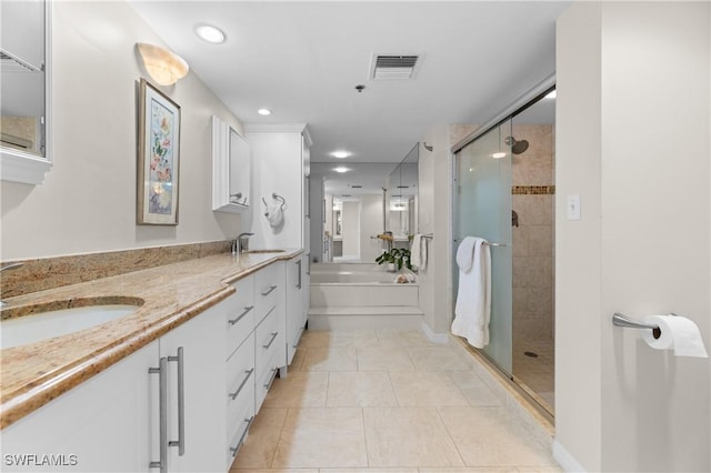 bathroom with vanity, tile patterned floors, and independent shower and bath