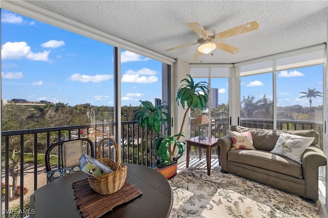 sunroom / solarium with ceiling fan