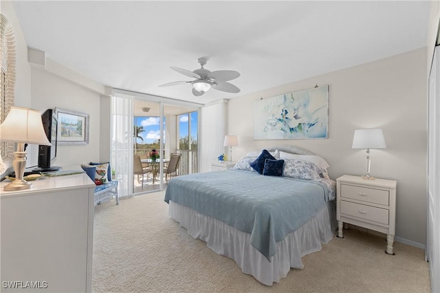 carpeted bedroom with access to outside, floor to ceiling windows, and ceiling fan