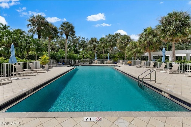 view of swimming pool with a patio area