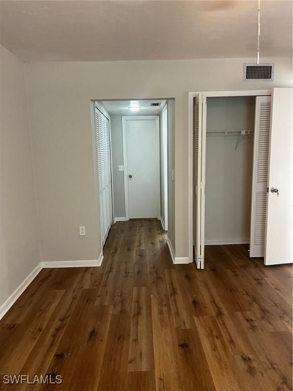 hall featuring dark hardwood / wood-style floors