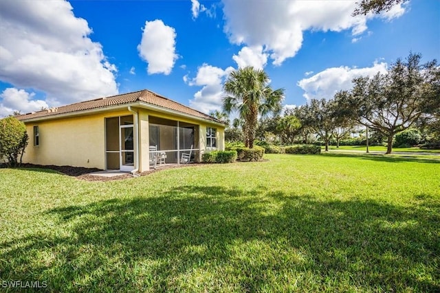 view of yard featuring a sunroom