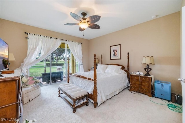 bedroom with access to outside, light carpet, and ceiling fan