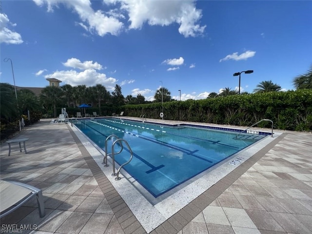 view of pool featuring a patio area