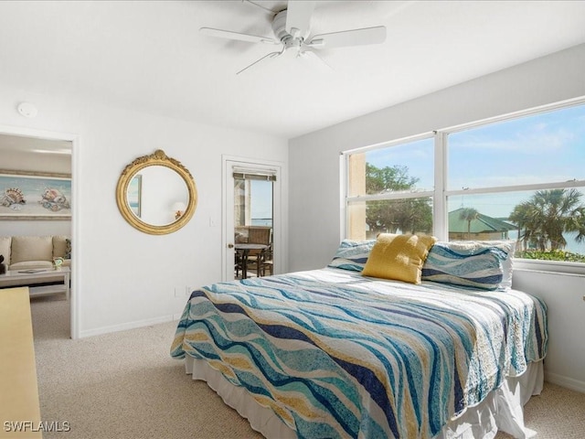 bedroom featuring light colored carpet and ceiling fan