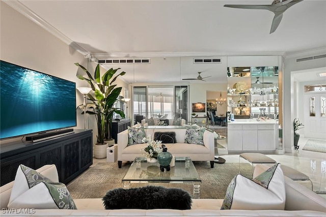 living room with crown molding and ceiling fan