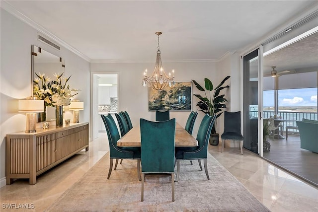 dining space with crown molding, a water view, and ceiling fan with notable chandelier