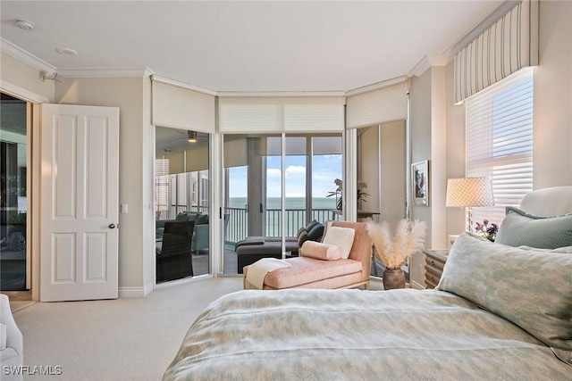 bedroom featuring ornamental molding, access to outside, light colored carpet, and a water view