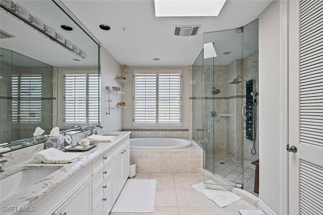 bathroom featuring vanity, plus walk in shower, and tile patterned flooring