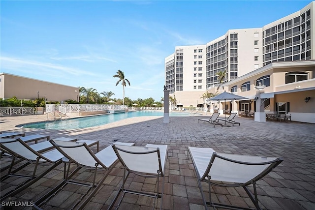 view of swimming pool with a patio