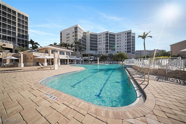 view of swimming pool with a patio area