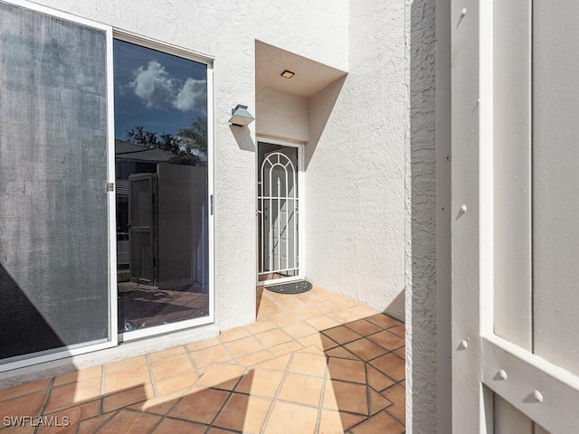 entrance to property with a patio area