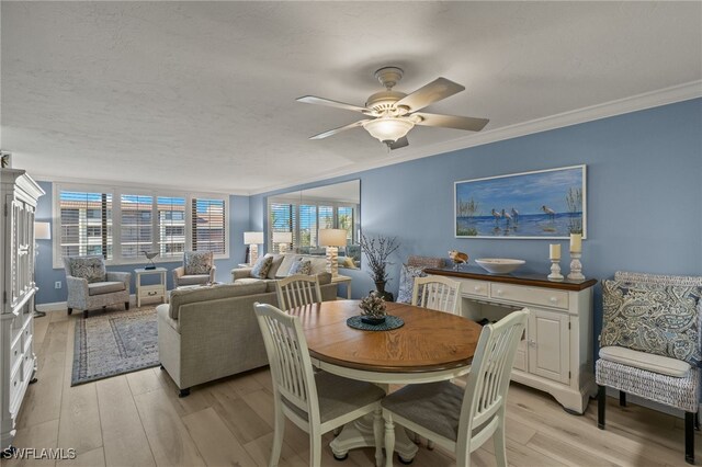 dining area with crown molding, a textured ceiling, ceiling fan, and light hardwood / wood-style flooring