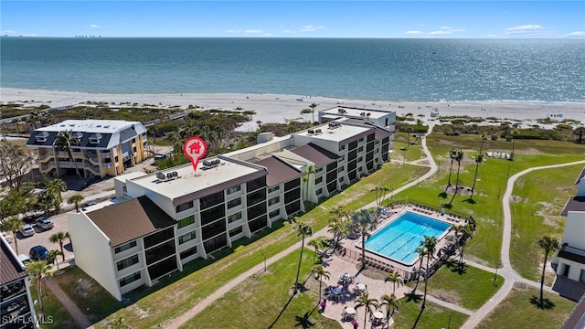 aerial view featuring a water view and a view of the beach