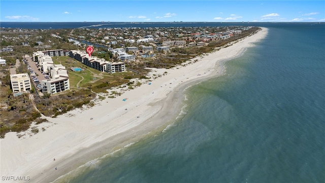 aerial view featuring a water view and a beach view