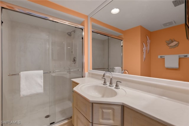 bathroom featuring vanity and walk in shower