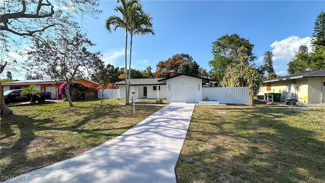 single story home with a garage and a front lawn