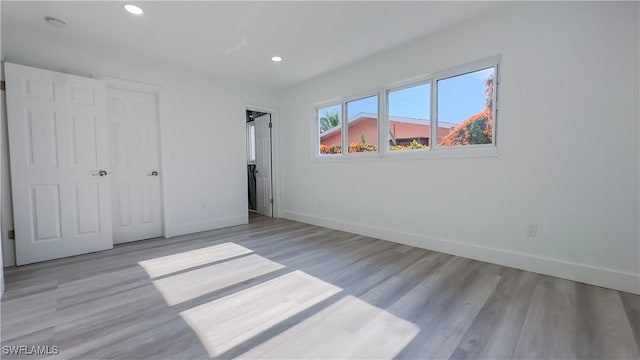 unfurnished bedroom featuring light wood-type flooring