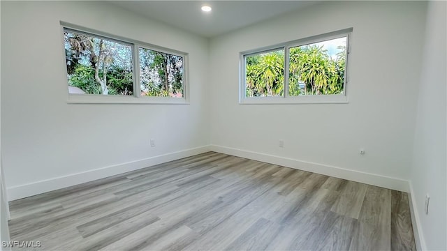 unfurnished room featuring light wood-type flooring