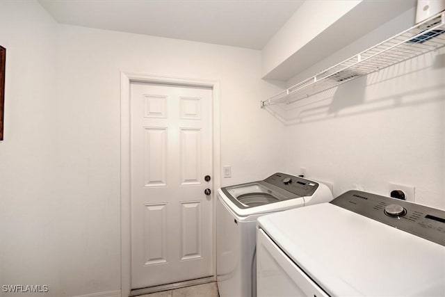 washroom with separate washer and dryer