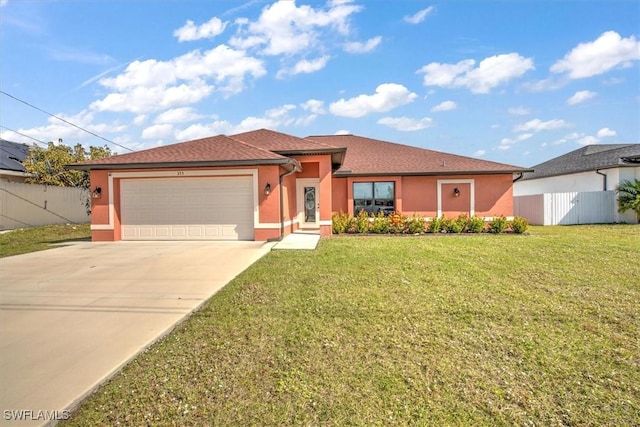 view of front of home featuring a garage and a front yard