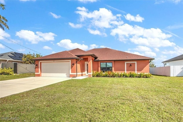 view of front of home with a garage and a front yard